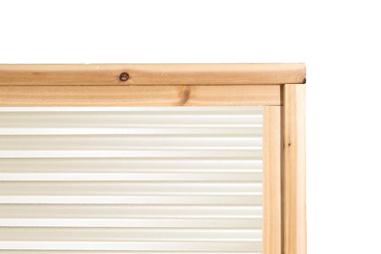 close up of cream-coloured horizontal oriented fence panel with cedar frame