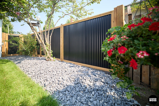 modern corrugated fence with wood posts