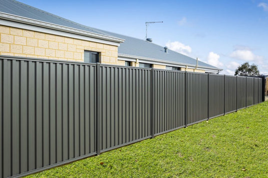 Corrugated Steel Fencing Panels In a Backyard