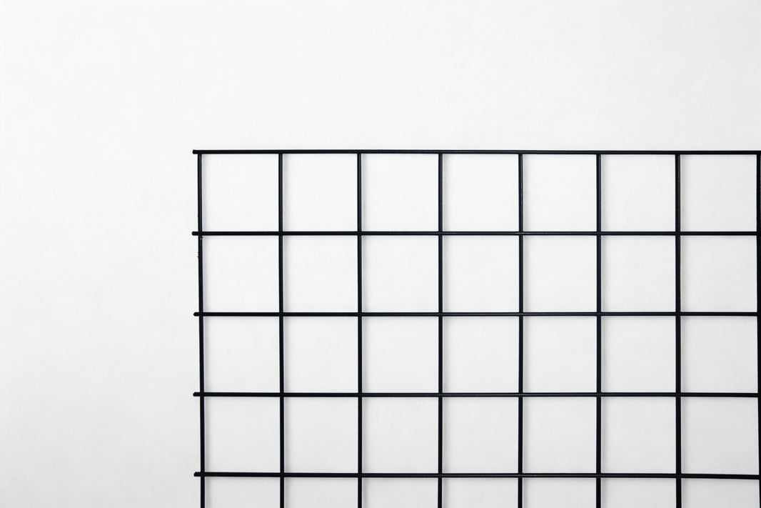 Unframed black hog wire panel, 4" x 4" mesh — BarrierBoss