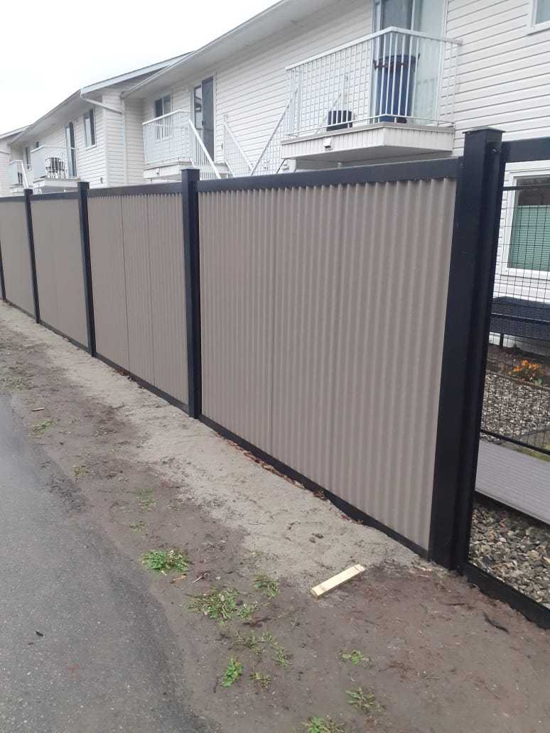 Load image into Gallery viewer, &quot;The True North&quot; - Zero Maintenance Corrugated Residential and Commercial Metal Fence Panels with Complete Steel Post and Frame System - The Forever Fence™
