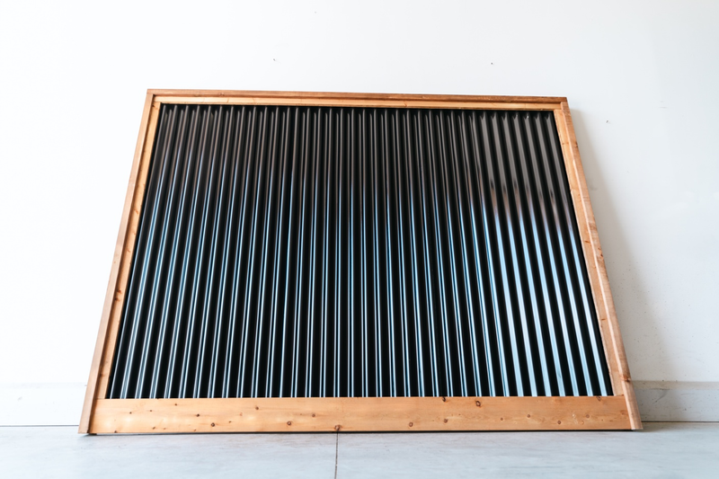 Load image into Gallery viewer, Corrugated Metal Fence Framed in Brown Pressure Treated Lumber - BarrierBoss™
