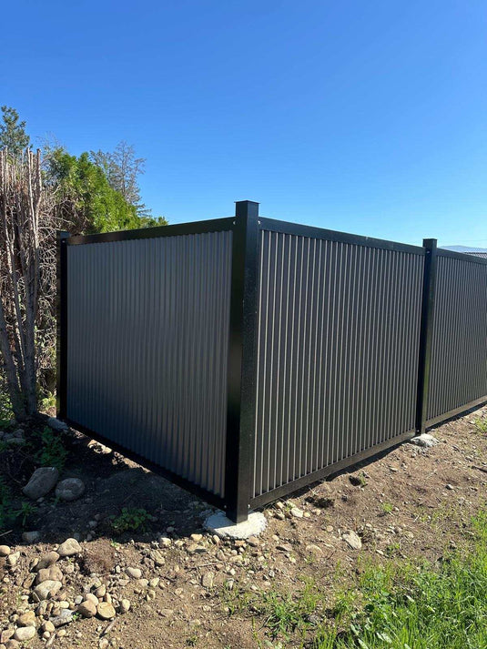 Zero maintenance corrugated metal fence panels with steel post and frame system.