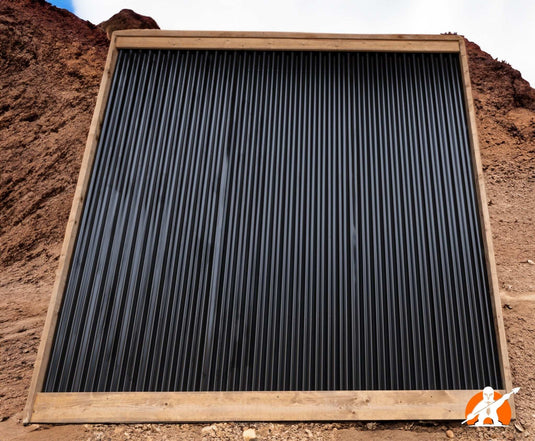 Corrugated Metal Fence Framed in Brown Pressure Treated Lumber - BarrierBoss™